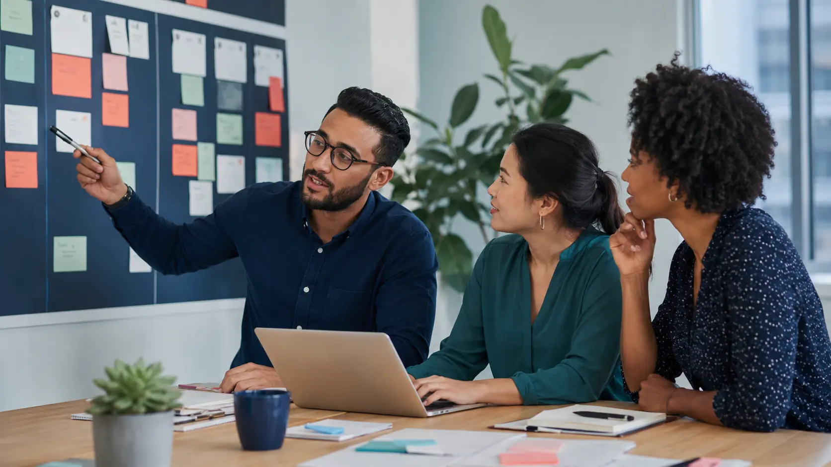 SEO consultant working with development and content teams SEO consultant collaborating with a developer and content strategist on an implementation roadmap